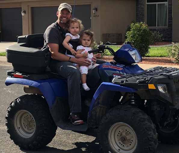 Justin Osmond taking a picture with his daughter.